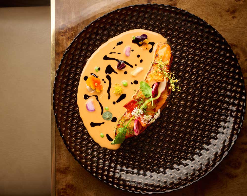 A plated dish at AMA by Brad Kilgore showcases its Italian soul influences.