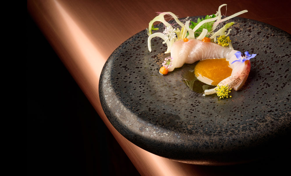 A table setting at AMA by Brad Kilgore presents food inspired by Japanese precision.